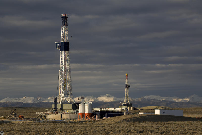 Drilling Rigs Turning to the Right Under Dark Wyoming Skies